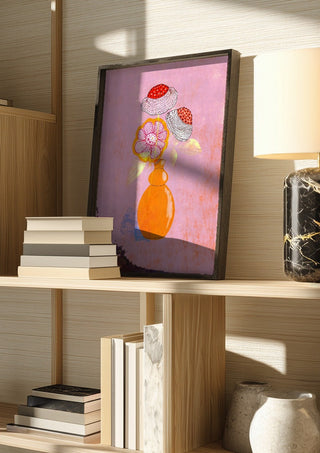Flowers in an Orange Vase by Creationsbyeditabrus in a dark frame on a wooden shelf beside books and a lamp