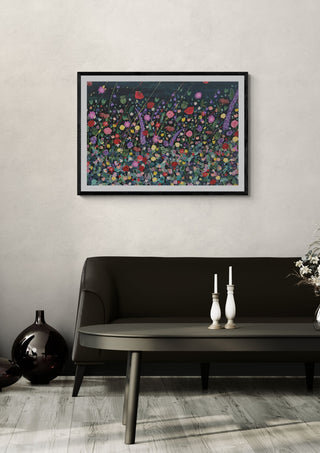 Corfe House by Rebecca Wright in a black frame on a pale wall above a dark sofa with candlesticks