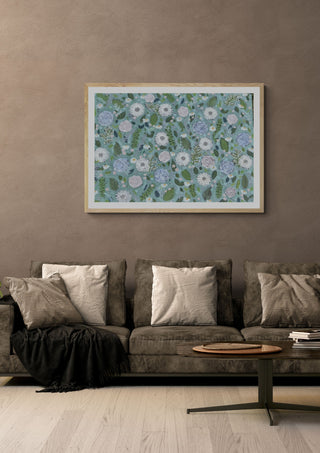 Sage Winter by Rebecca Wright in a light oak frame on a warm grey wall above a brown sofa