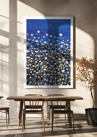 Daisies by Rebecca Wright hanging above a wooden dining table in warm sunlight