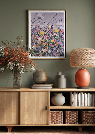 Silver street by Rebecca Wright above a wooden sideboard on a sage green wall