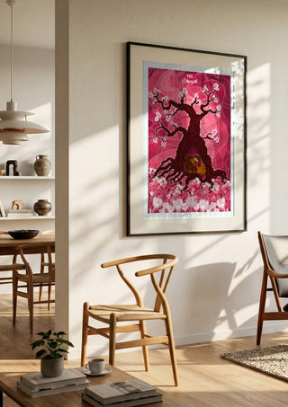 The Strength by Sciurus tarotus in a large black frame in a bright dining room