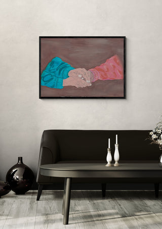 Beautiful kindness by Sulaika Martis in a black frame on a pale wall above a dark sofa with candlesticks