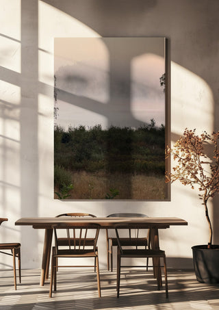 När älvorna dansar by Ljilja Marinic hanging above a wooden dining table in warm sunlight