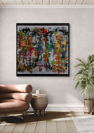Schmetterling by ullimcart in a black frame above a tan leather sofa beside a potted palm