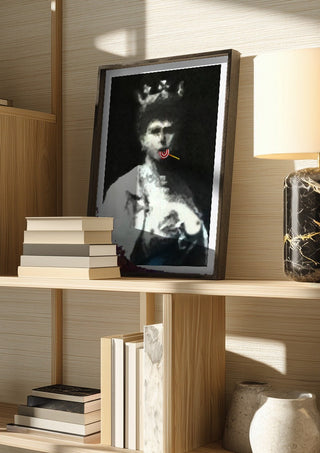 The Midnight Queen by Bent Hardervig in a dark frame on a wooden shelf beside books and a lamp