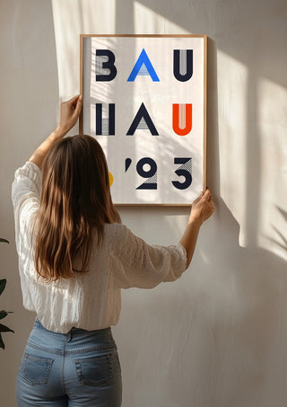 Bauhaus Letters by Neil Stevens being hung on a sunlit wall