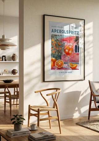 Estate Italiana by Ohkimiko in a black frame in a bright dining room with wooden chairs
