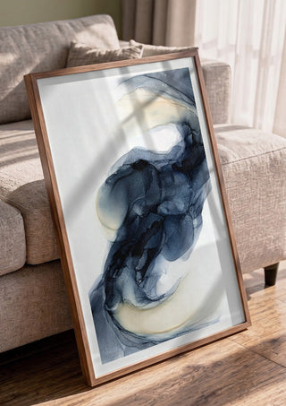Frozen Light by Anna Dormir in a walnut frame leaning against a grey sofa