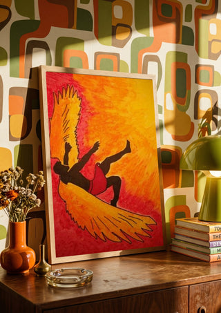 Manie oder der Flug des Ikarus by Olaf Baier in a wooden frame on a sideboard against a retro patterned wall