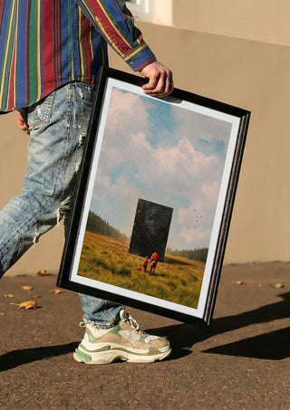 Son, this is the Universe by Fran Rodriguez carried in a black frame along a sunny street