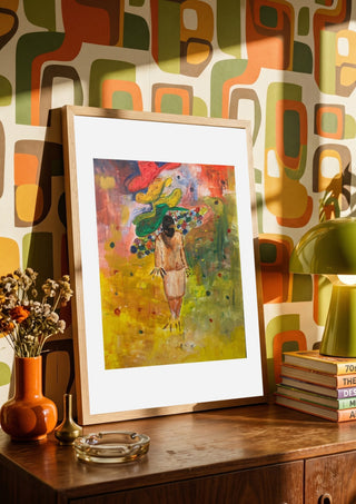 The weight of the world full colour by Madame Petit in a wooden frame on a sideboard against a retro patterned wall