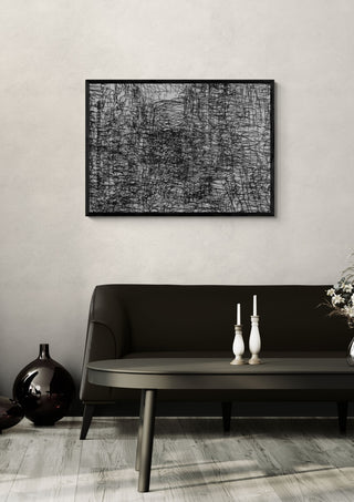 Hesburger by Priit Ruttas in a black frame above a dark sofa with candlesticks