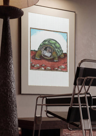 The Reading Tortoise by Waldemar Mandzel framed in a dim room beside a tubular steel chair
