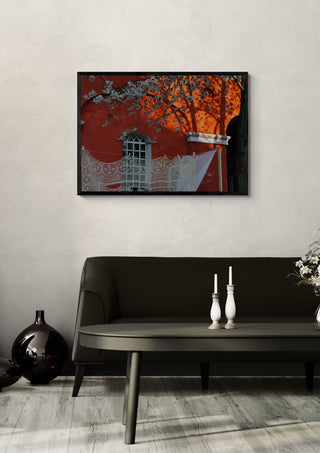 Lace and Blossom, Christiania by Helene Høie in a black frame above a dark sofa with candlesticks