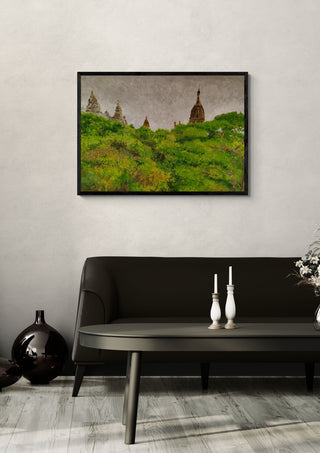 Temple jungle by GAHO in a black frame above a dark sofa with candlesticks