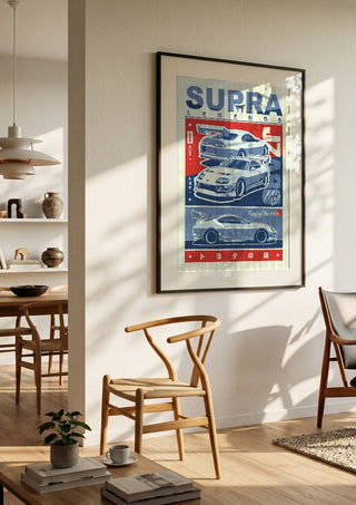 Toyota Supra MK4 by Kaminarirace in a black frame in a bright dining room with wooden chairs