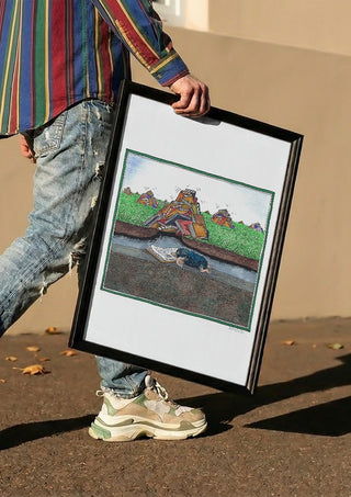 The Reading Mole by Waldemar Mandzel carried in a black frame along a sunny street