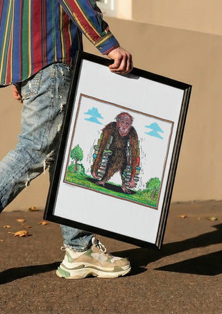 Ape with Books by Waldemar Mandzel carried in a black frame along a sunny street