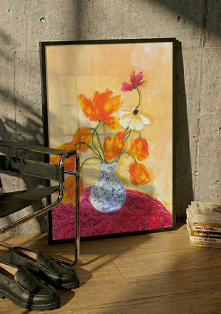 November Tulips by Deblina Dey in a black frame leaning against a concrete wall by a steel chair