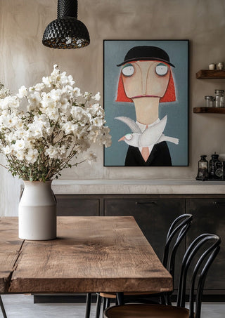 Malwines Strickmöwe by lacaluna in a black frame above a rustic table with white flowers