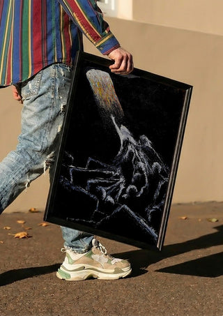 HOPE by GAHO carried in a black frame along a sunny street