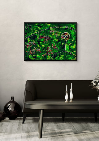 Racing Mutants by Will Black in a black frame above a dark sofa with white candlesticks