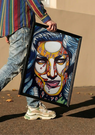Lauren Bacall by Okiana carried in a black frame along a sunny street