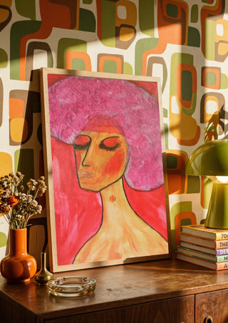 woman with a birthmark by Ian Frederick Harris in a wooden frame on a sideboard against retro patterned wallpaper