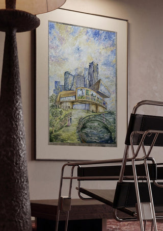 Modern Monet by Ramona’s art framed in a dim room beside a tubular steel chair
