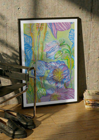 Sfumature blu by Maria Emanuela Fiori in a black frame leaning against a concrete wall by a steel chair