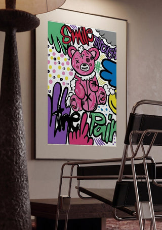 Smile Through The Pain by Bibi framed in a dim room beside a tubular steel chair