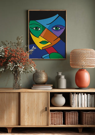 Mosaic of the Psyche by Bibi above a wooden sideboard on a sage green wall