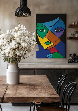 Mosaic of the Psyche by Bibi in a black frame above a rustic table with white flowers