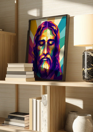 Jesus Face by nyai in a dark frame on a wooden shelf beside books and a lamp