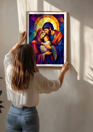 The Holy Family in Divine Light by nyai being hung on a sunlit wall