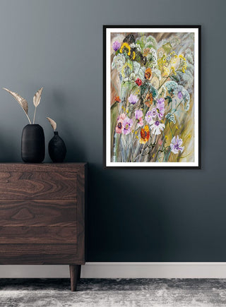 Framed "Where The Wild Flowers Grow" by Martina Karlsson displayed on a dark wall above a wooden dresser.