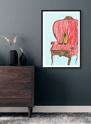 Framed "Queens Throne" artwork by Martina Karlsson on a dark wall above a wooden dresser with vases.