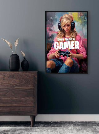 Poster of a girl with headphones and game controller, captioned "Born to be a GAMER," on a modern room wall.