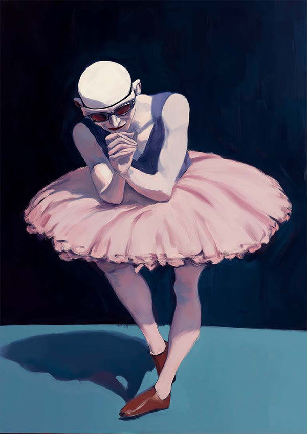 A male ballet dancer in a pink tutu and brown shoes stands poised under dramatic lighting.