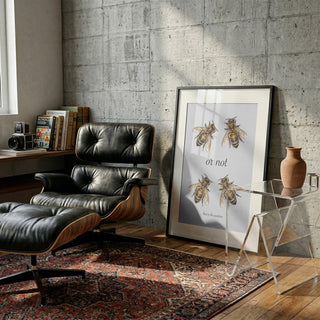 Framed "To Bee Or Not" artwork by Andreas Magnusson displayed in a modern living room setting.