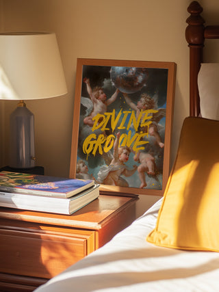 Framed Divine Groove - Dikhotomy album artwork on a bedside table next to books and a lamp.