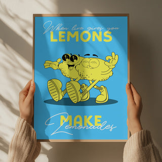 Hands holding a poster of two smiling cartoon lemons with text: "When life gives you lemons, make lemonade."