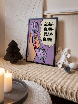 Framed Blah Blah Blah - Andreas Magnusson artwork on a woven table with candles and decorative items nearby.