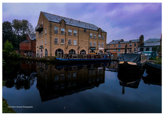 Canal Wharf at Dusk by Northern Gnome Photography - stone mill and narrowboats reflected in a canal at dusk