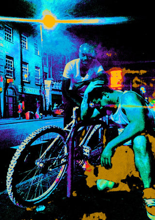 Bike Boys by Pelecan Schneider - two men and a mountain bike on a London street at night in electric blue and magenta