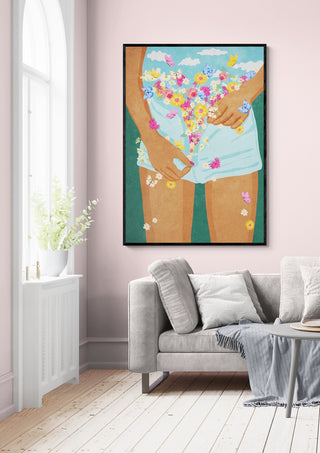 Framed "Flower Mood" by Raissa Oltmanns above a beige sofa in a bright, modern living room.