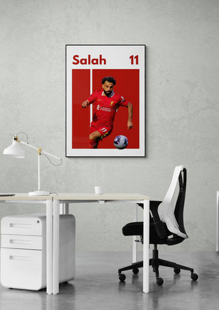 Salah Liverpool Football Poster featuring player number 11 in a red kit, displayed above an office desk.