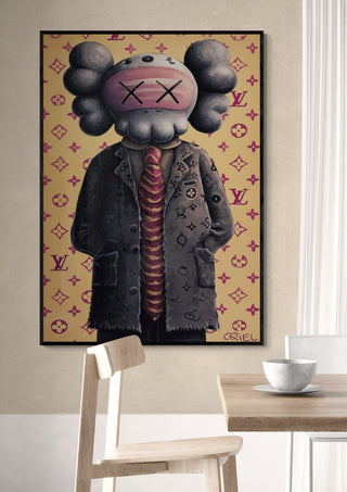 Framed Old School Kaws - Danii Steinfeldt artwork on wall above a wooden chair in modern room.