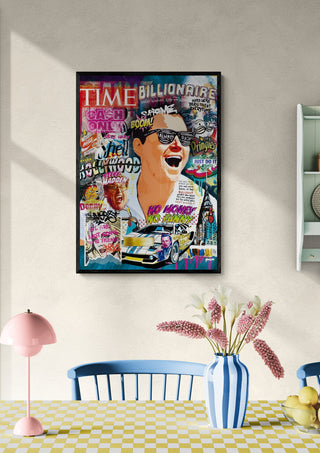 Colorful "Wolf of Wall Street 2 - Ricardo Noble" artwork on a wall above a checked table with flowers.